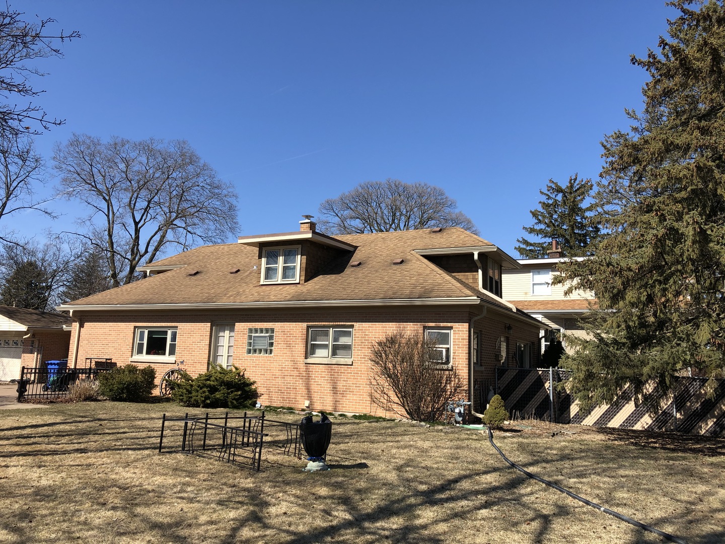1390 South River Road Des Plaines, IL 60018 - Photo 2 of 4 a front view of a house with a yard