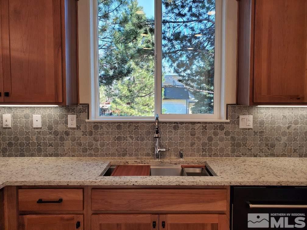 1431 Washington Street Reno, NV 89503 - Photo 8 of 25 a kitchen with granite countertop a sink and cabinets