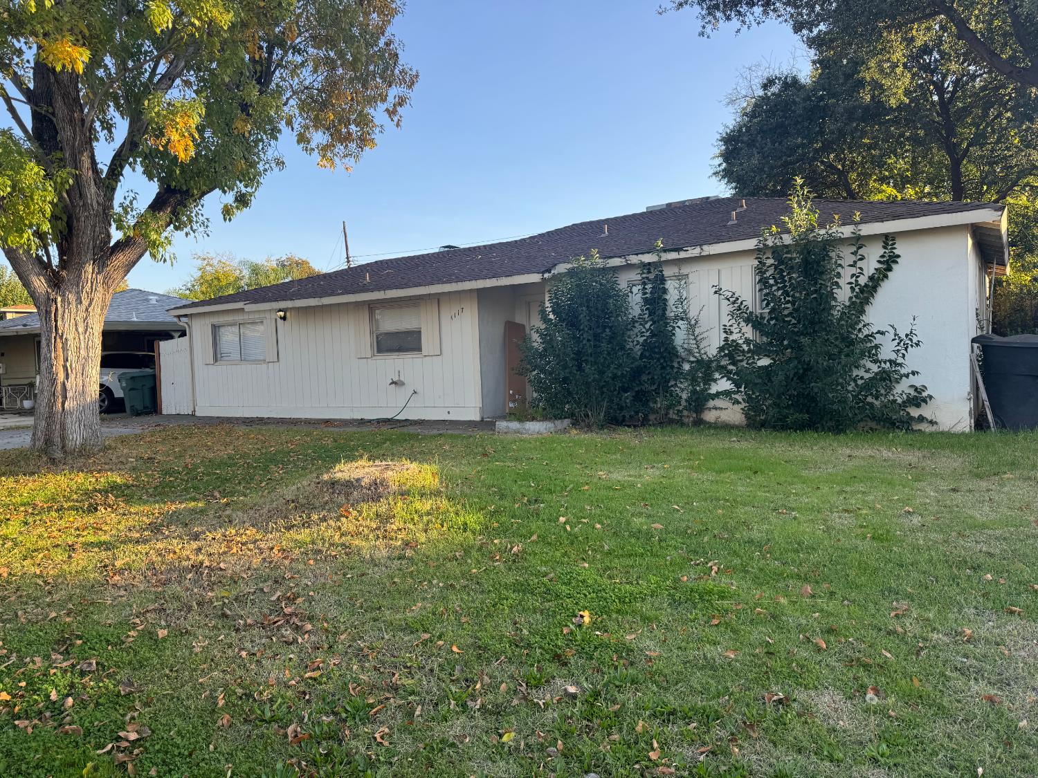 1117 Singingwood Road Sacramento, CA 95864 - Photo 1 of 1 a backyard of a house with plants and large tree
