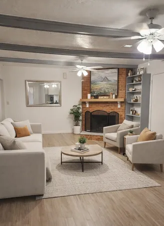 a living room with furniture and a potted plant