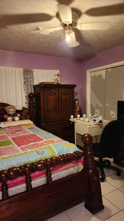 a room with gym equipment and a mirror