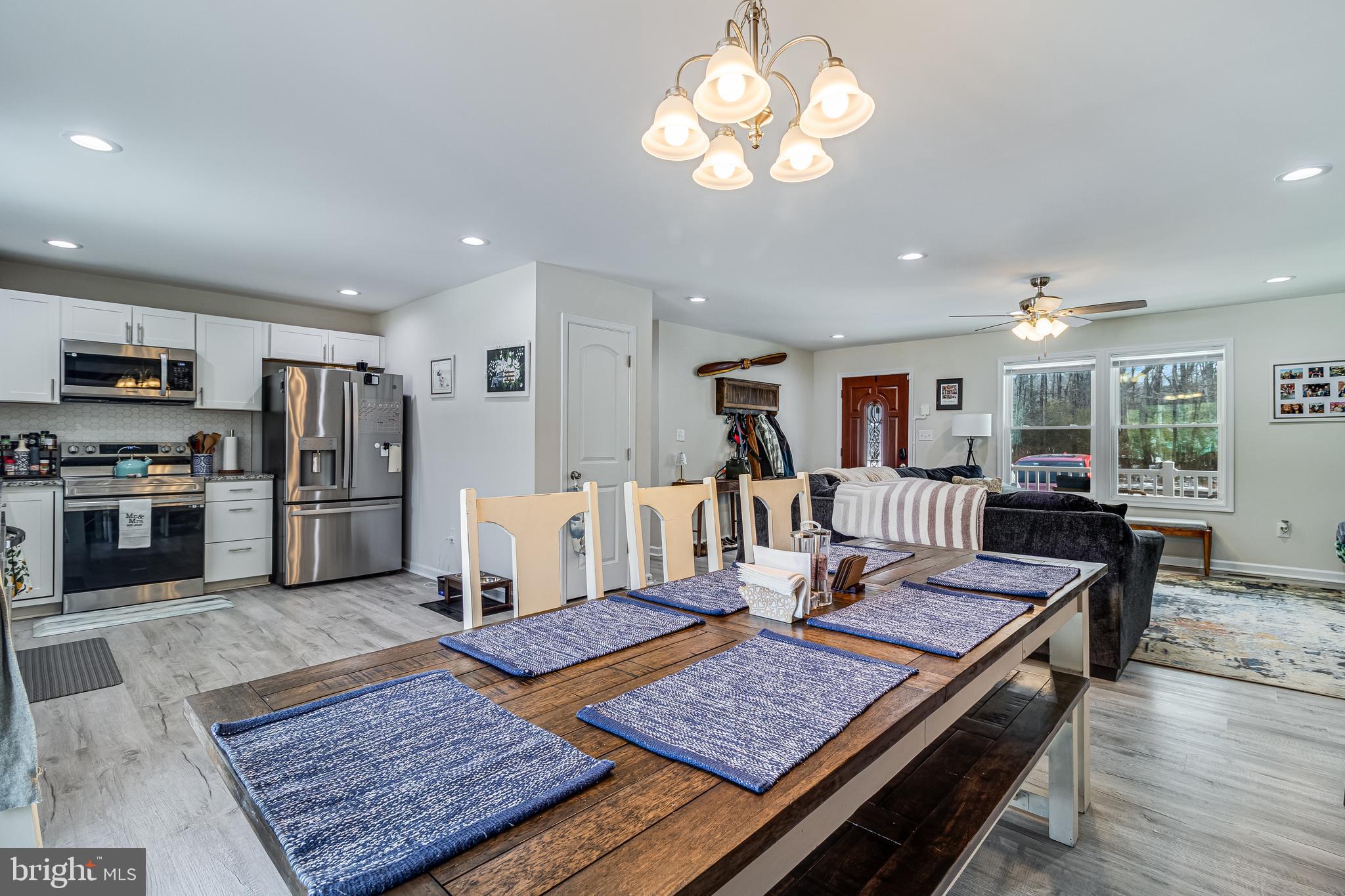 339 Azure Drive Colonial Beach, VA 22443 - Photo 13 of 28 a kitchen with a table and chairs in it