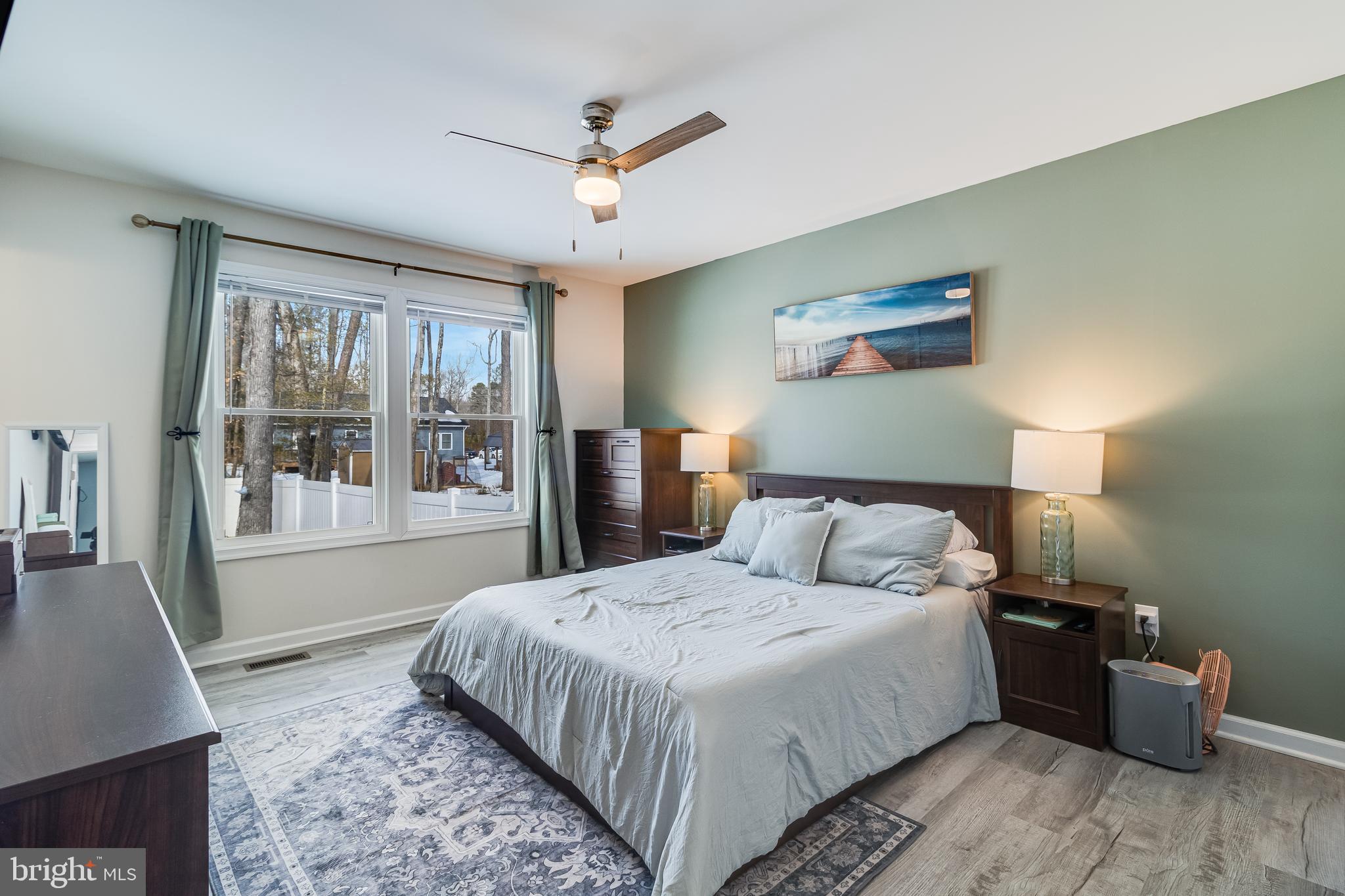 339 Azure Drive Colonial Beach, VA 22443 - Photo 14 of 28 a bedroom with a large bed and a window
