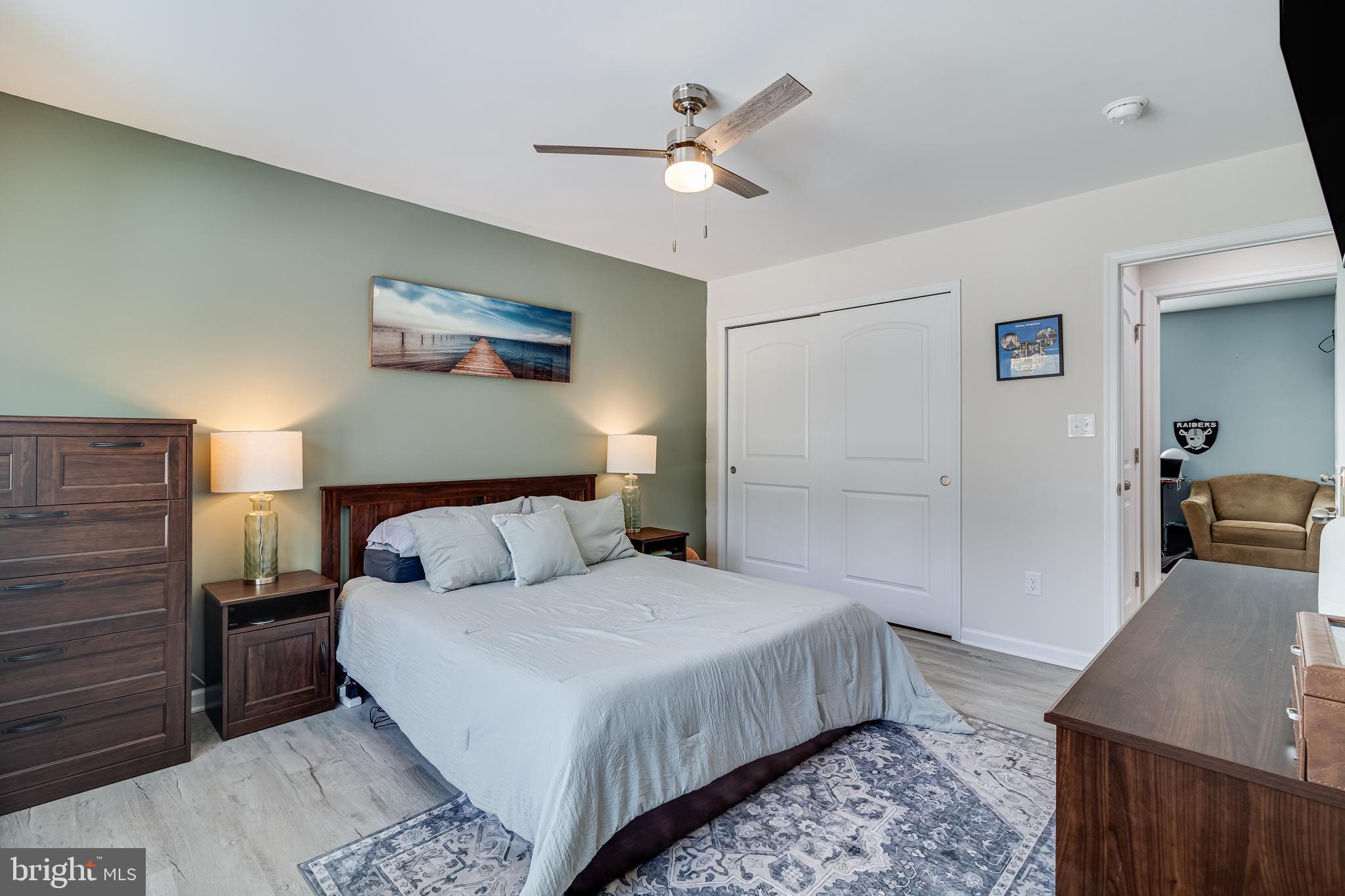339 Azure Drive Colonial Beach, VA 22443 - Photo 15 of 28 a bedroom with a large bed and a chandelier