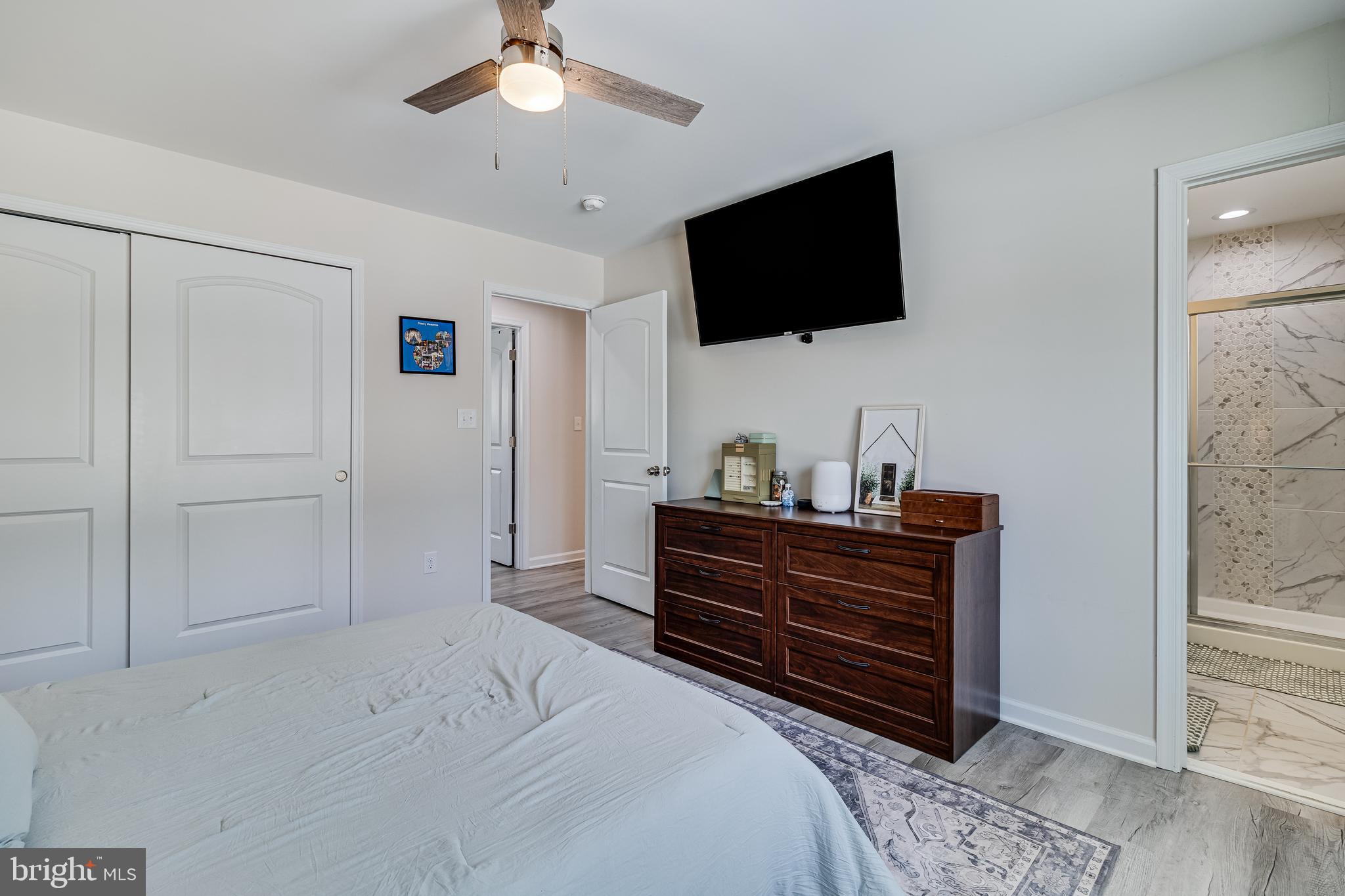 339 Azure Drive Colonial Beach, VA 22443 - Photo 16 of 28 a room with a bed and a flat screen tv