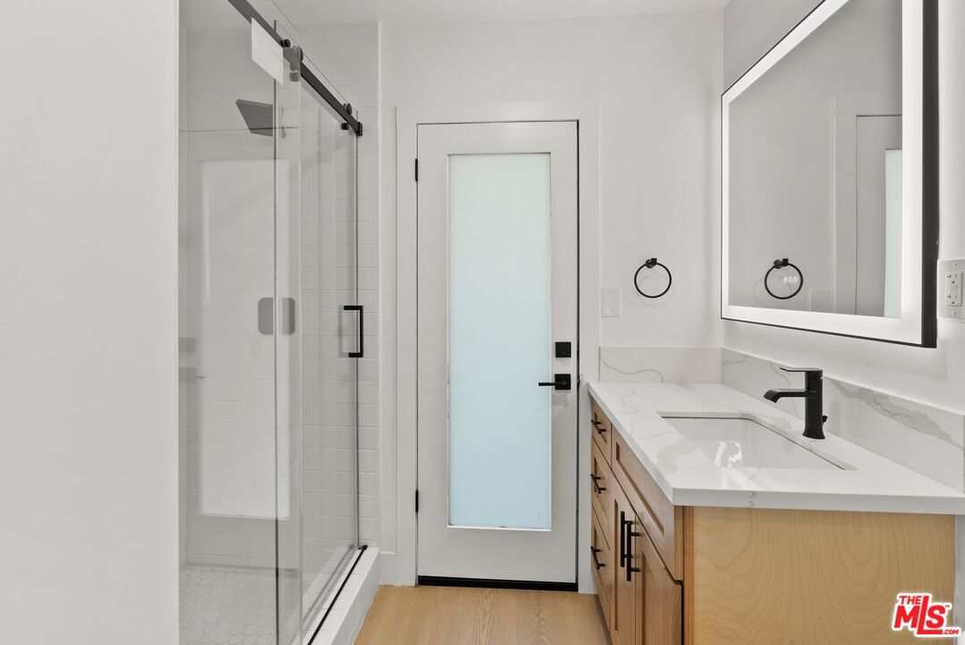 4020 La Salle Avenue Culver City, CA 90232 - Photo 25 of 33 a bathroom with a sink and a mirror
