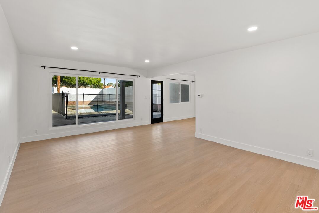 4020 La Salle Avenue Culver City, CA 90232 - Photo 4 of 33 wooden floor in an empty room with a window
