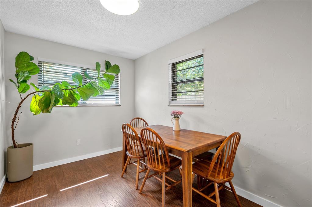 3000 North 15th A Street Waco, TX 76708 - Photo 11 of 24 a view of a dining room with furniture and a potted plant