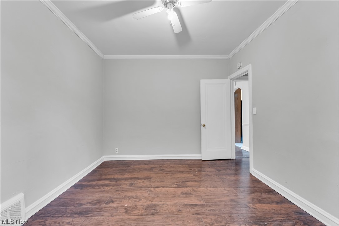1499 Sherbrook Road South Euclid, OH 44121 - Photo 37 of 41 Spare room with dark hardwood / wood-style floors, ceiling fan, and ornamental molding
