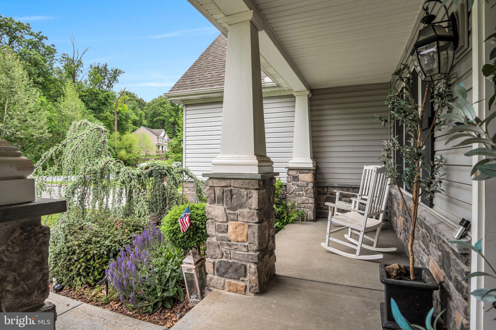 110 Freys Road Elizabethtown, PA 17022 - Photo 4 of 47 Charming porch with lush greenery.