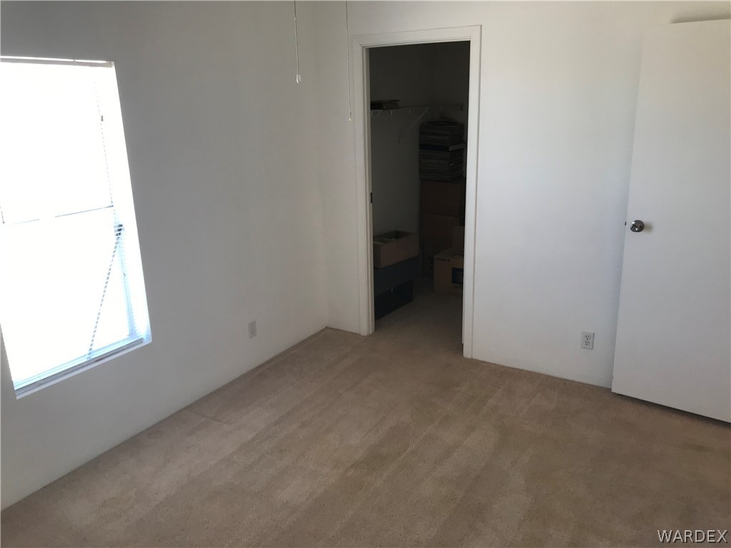 3503 Adobe Road Golden Valley, AZ 86413 - Photo 13 of 27 an empty room with windows