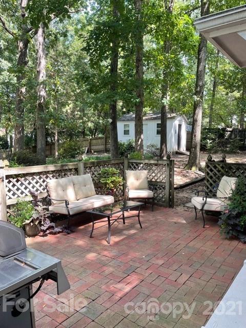 9101 Sardis Forest Drive Charlotte, NC 28270 - Photo 3 of 5 a patio with patio a couch and chairs