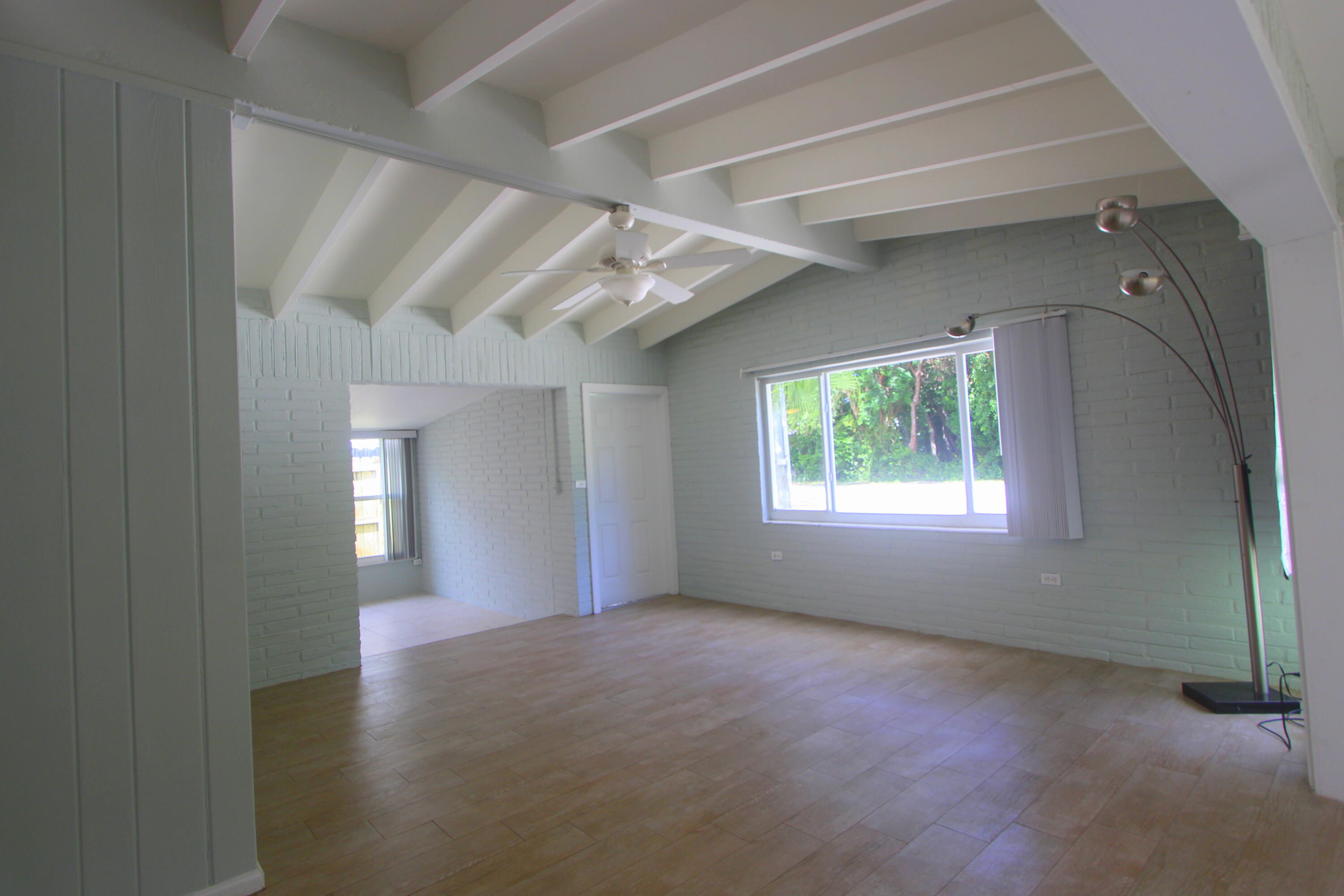39 Bass Avenue Key Largo, FL 33037 - Photo 11 of 22 a view of livingroom with window and hardwood floor