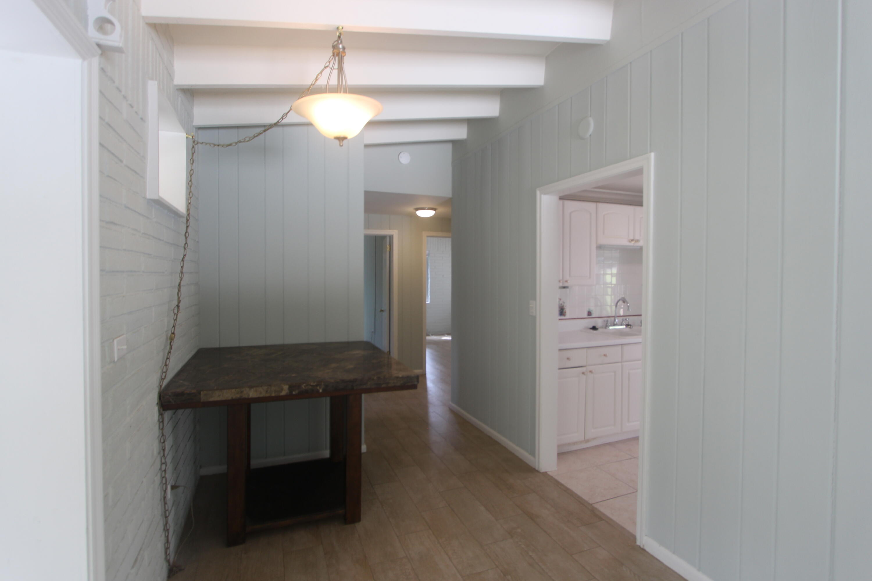 39 Bass Avenue Key Largo, FL 33037 - Photo 12 of 22 a room that has a mirror and a wooden floor