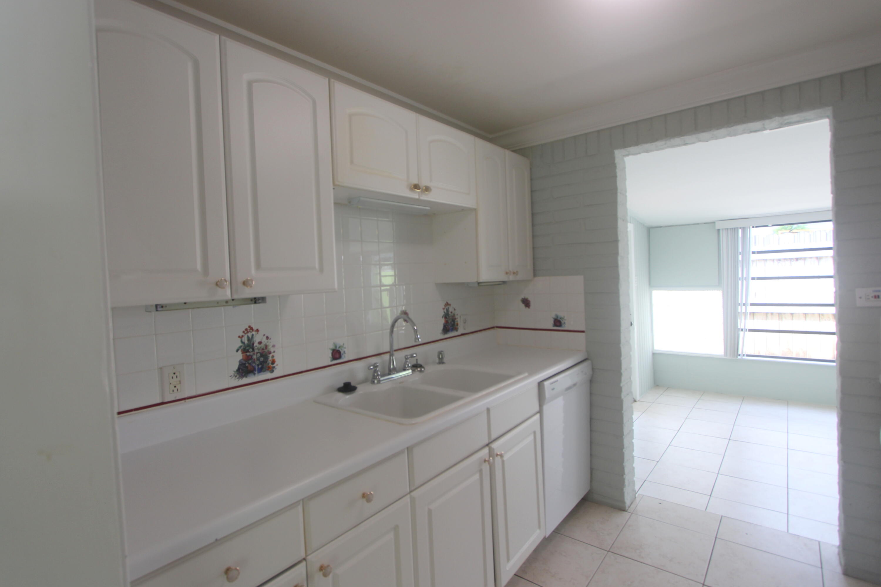 39 Bass Avenue Key Largo, FL 33037 - Photo 13 of 22 a kitchen with a sink cabinets and utility