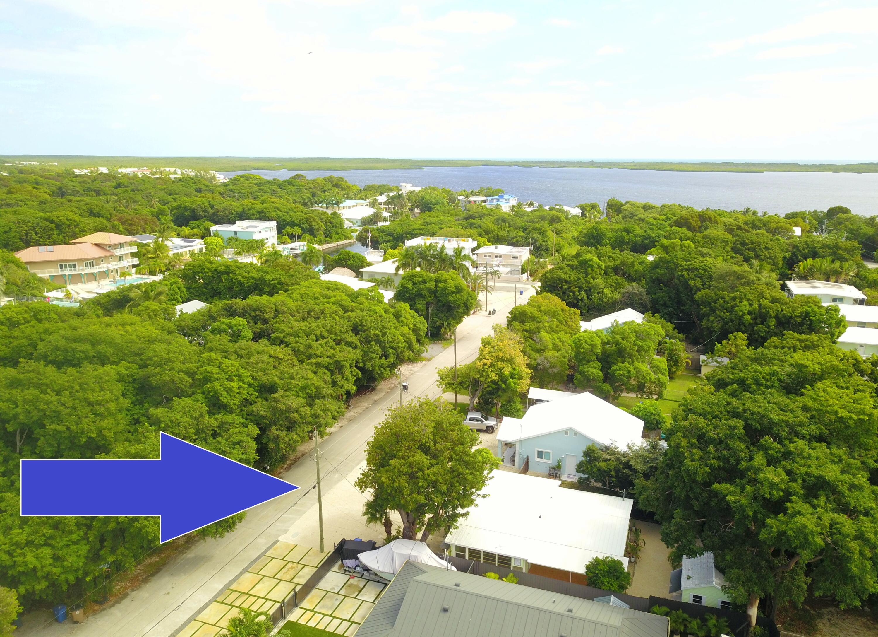 39 Bass Avenue Key Largo, FL 33037 - Photo 2 of 22 an aerial view of residential houses with outdoor space and trees