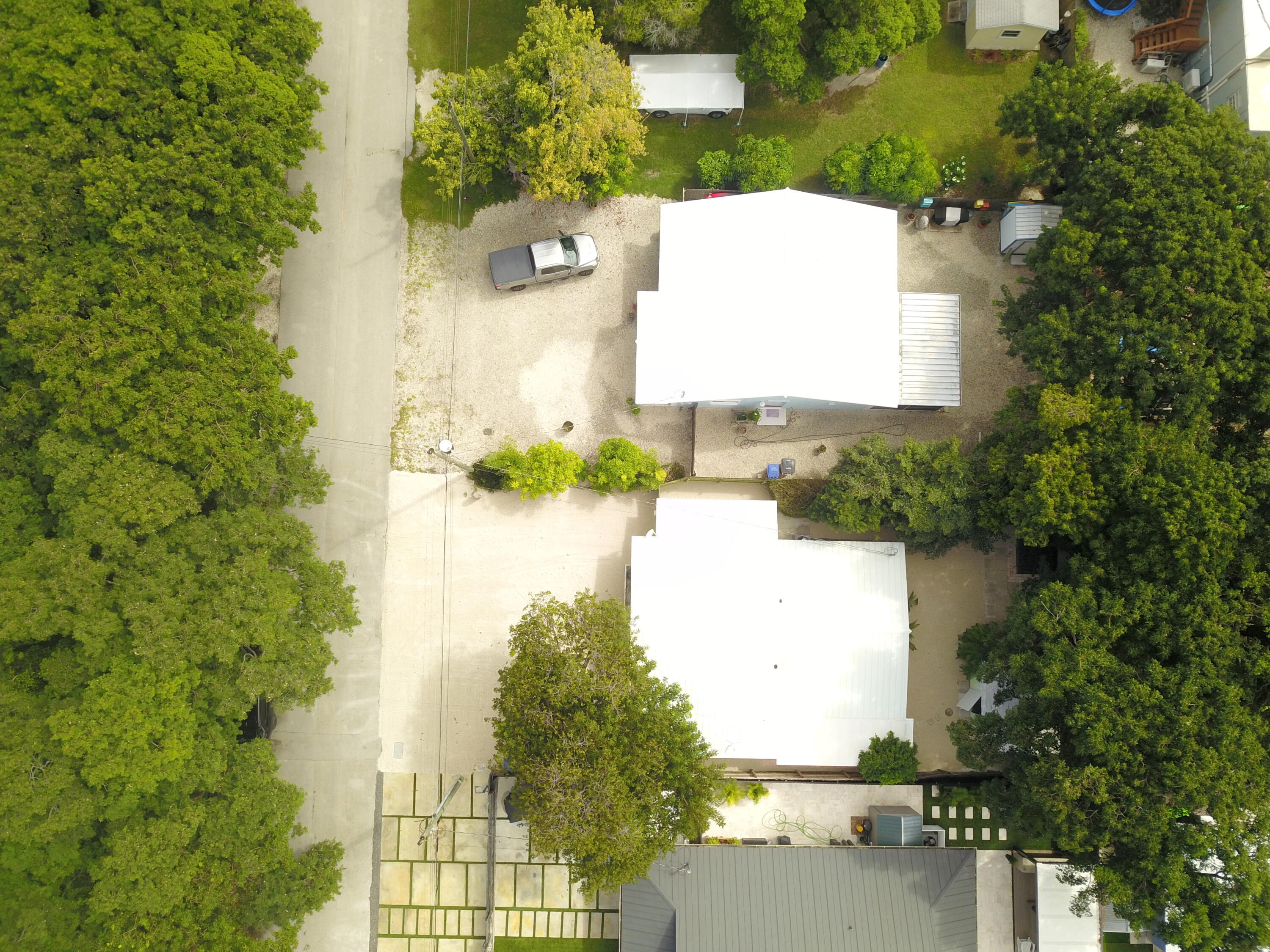 39 Bass Avenue Key Largo, FL 33037 - Photo 6 of 22 an aerial view of a house with a yard and lake view