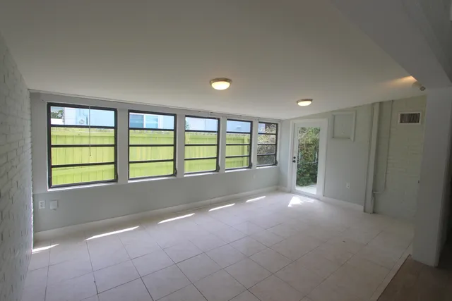 a view of an empty room with a window