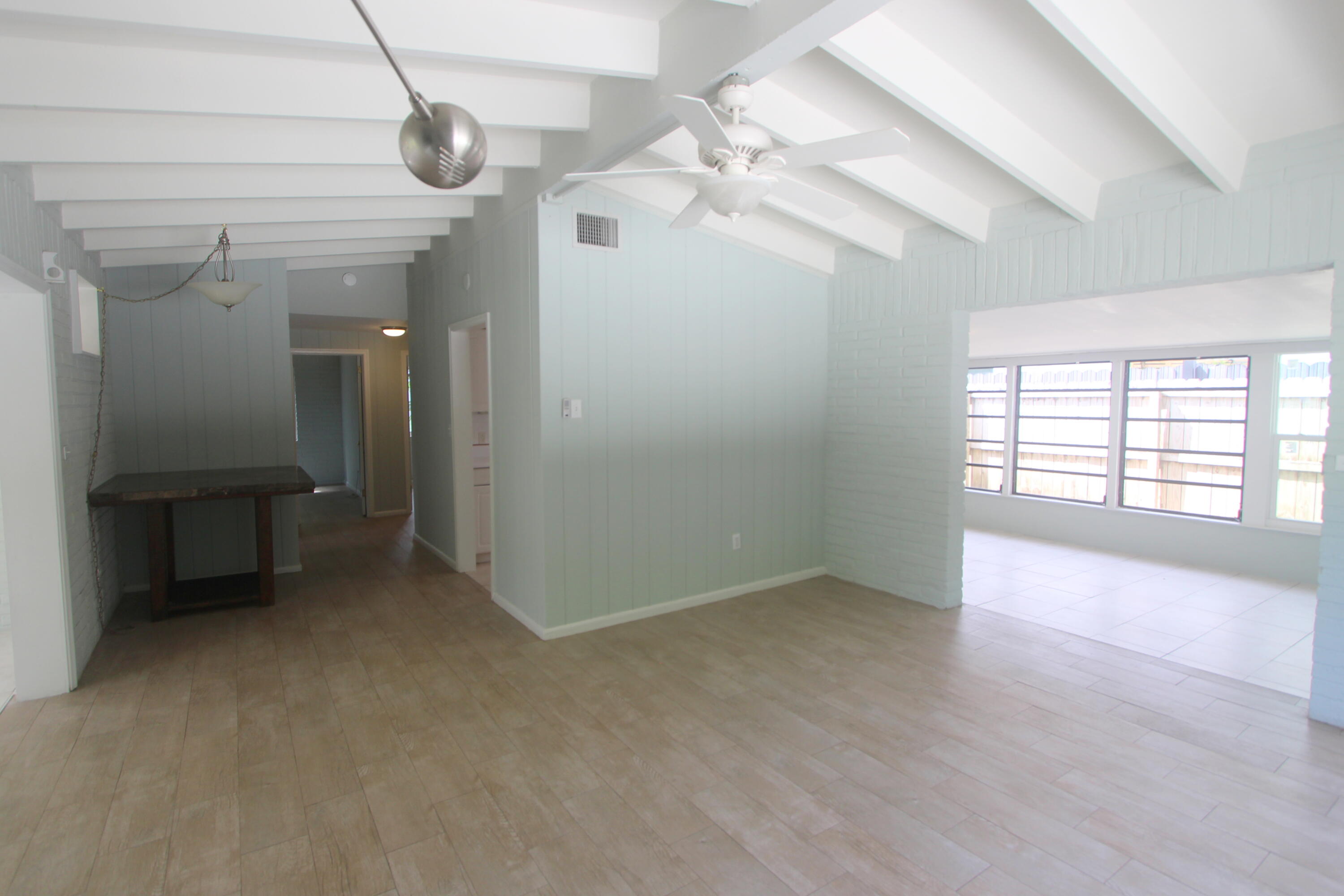 39 Bass Avenue Key Largo, FL 33037 - Photo 9 of 22 en empty room with windows and ceiling fan
