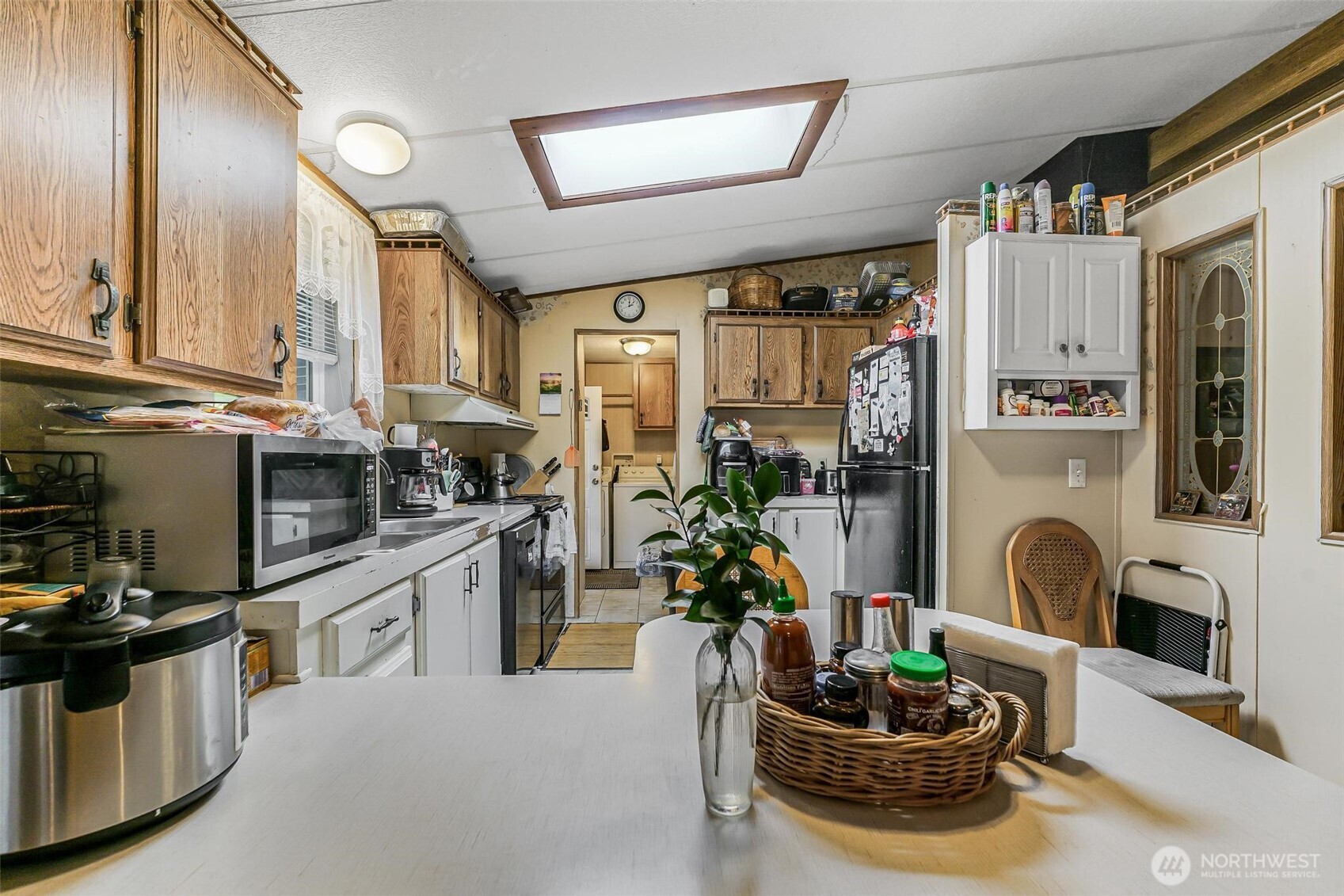 980 South Falcon Road Camano Island, WA 98282 - Photo 5 of 30 a kitchen with a refrigerator and a stove