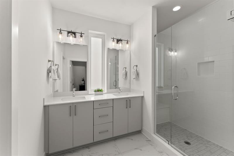 1256 Chelsea Circle Northwest Atlanta, GA 30318 - Photo 23 of 52 a bathroom with a double vanity sink mirror and shower