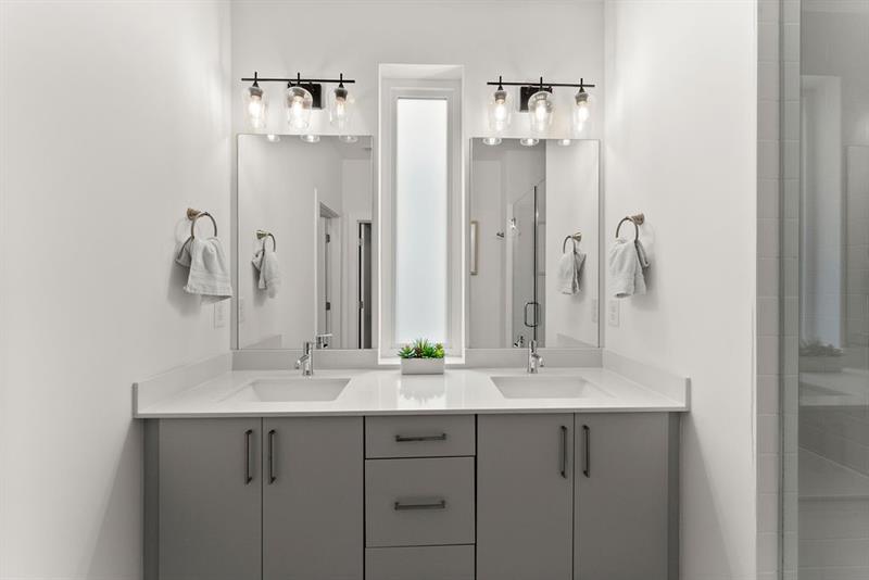 1256 Chelsea Circle Northwest Atlanta, GA 30318 - Photo 24 of 52 a bathroom with a double vanity sink mirror and shower