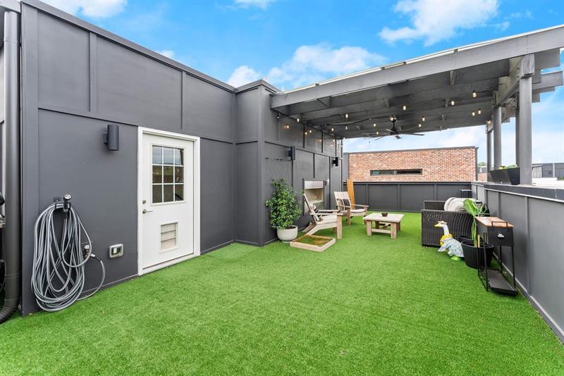 1256 Chelsea Circle Northwest Atlanta, GA 30318 - Photo 32 of 52 a view of a porch with chairs and backyard