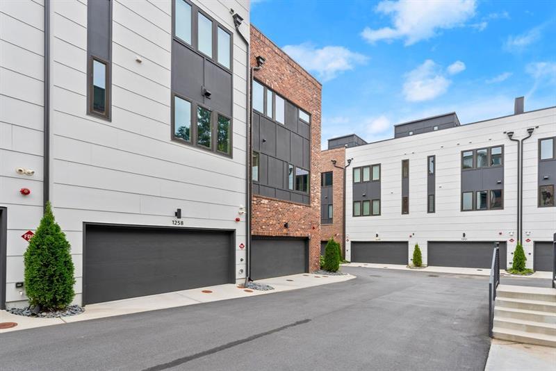 1256 Chelsea Circle Northwest Atlanta, GA 30318 - Photo 39 of 52 a front view of a building with a garage