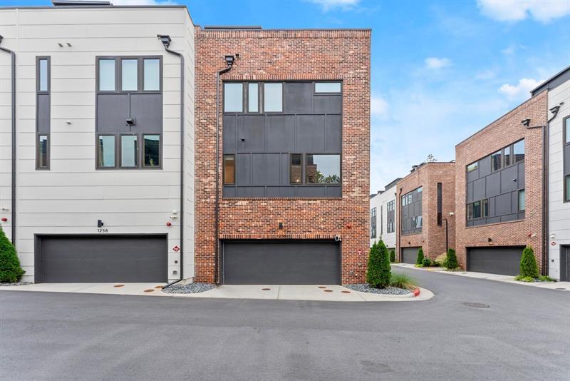 1256 Chelsea Circle Northwest Atlanta, GA 30318 - Photo 40 of 52 a front view of a building with a street