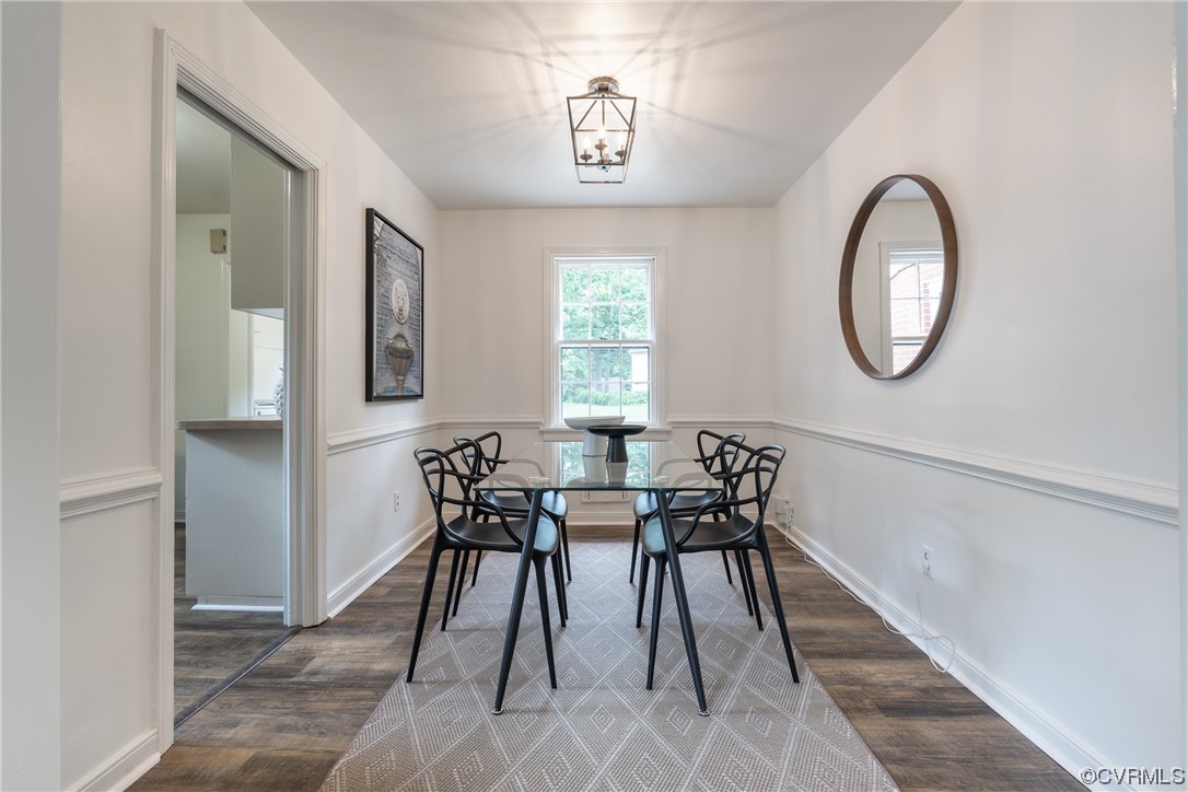 9004 Penguin Road Henrico, VA 23229 - Photo 11 of 42 Dining room with chair rail and lantern chandelier.