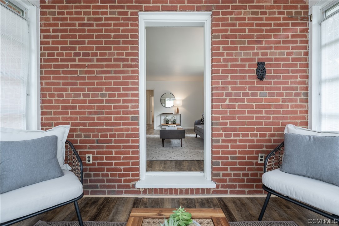 9004 Penguin Road Henrico, VA 23229 - Photo 29 of 42 Sunroom with exposed brick wall and ceiling fan.