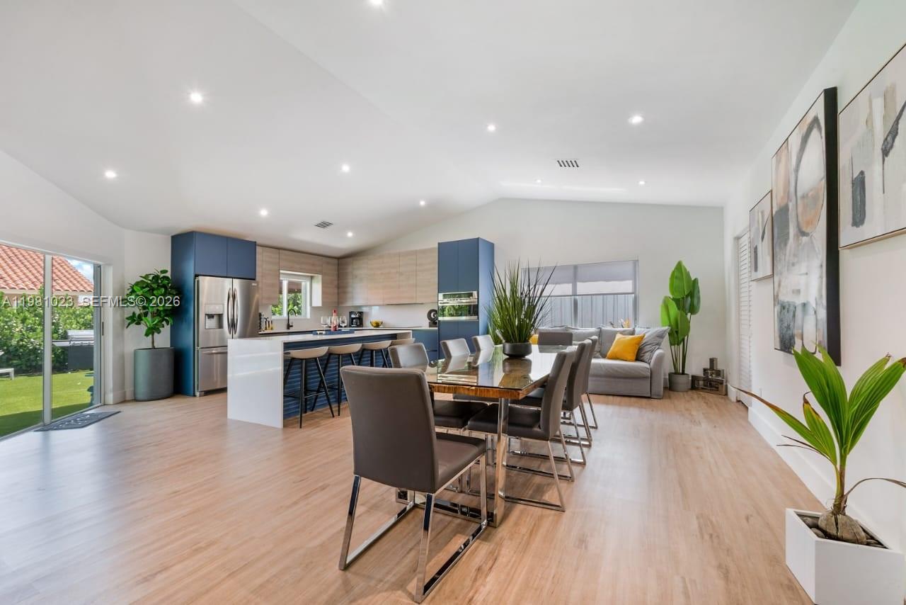 14481 Southwest 161 Street Miami, FL 33177 - Photo 15 of 24 a view of a dining room with furniture and wooden floor