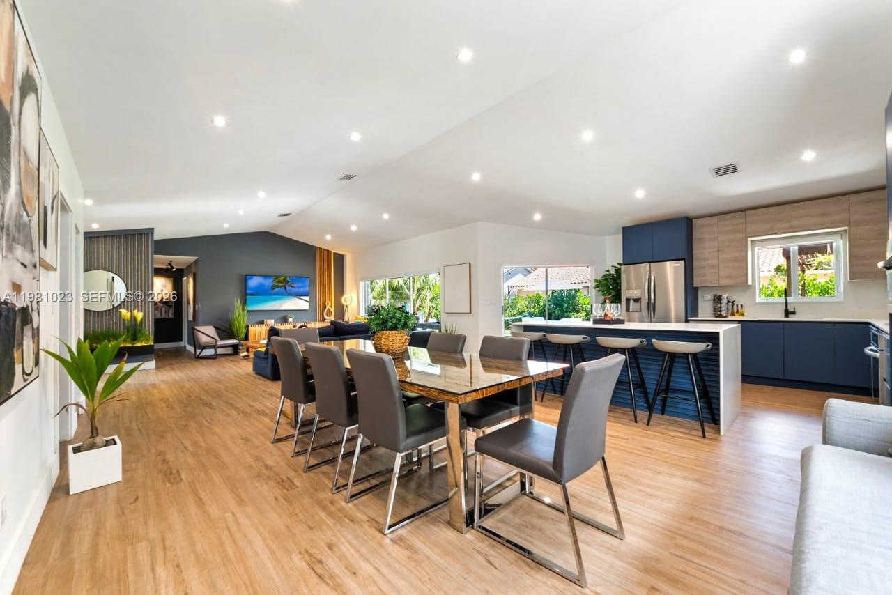 14481 Southwest 161 Street Miami, FL 33177 - Photo 16 of 24 a view of a dining room with furniture kitchen and wooden floor