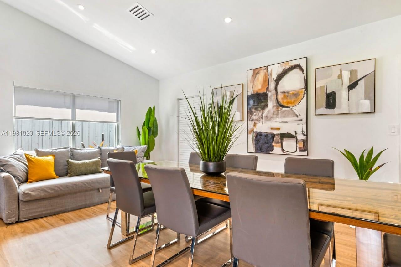 14481 Southwest 161 Street Miami, FL 33177 - Photo 17 of 24 a living room with furniture potted plant and a large window