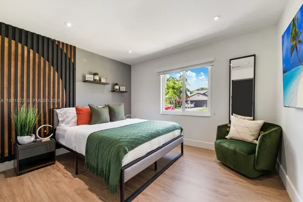 a bedroom with a bed and a couch