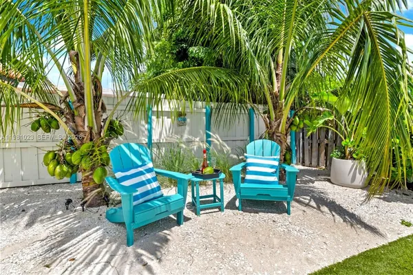 a green bench sitting in the middle of a park