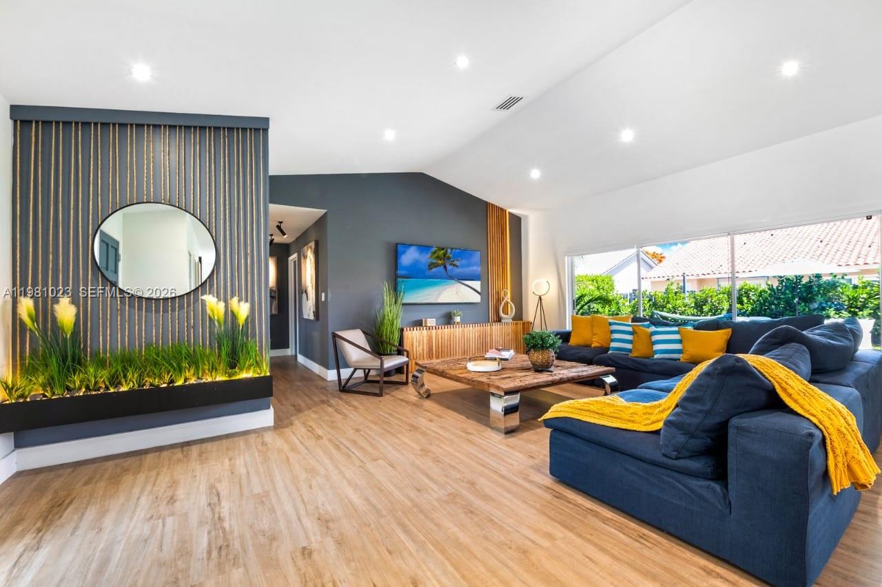 14481 Southwest 161 Street Miami, FL 33177 - Photo 10 of 24 a living room with furniture fireplace and a large window