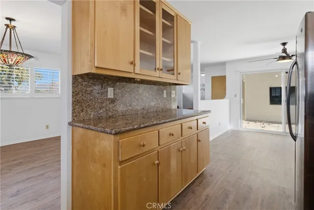 a kitchen with stainless steel appliances granite countertop a sink and cabinets