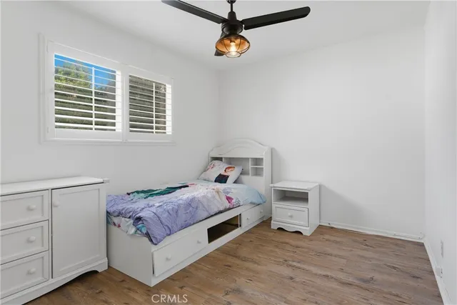 a room with a bed and window