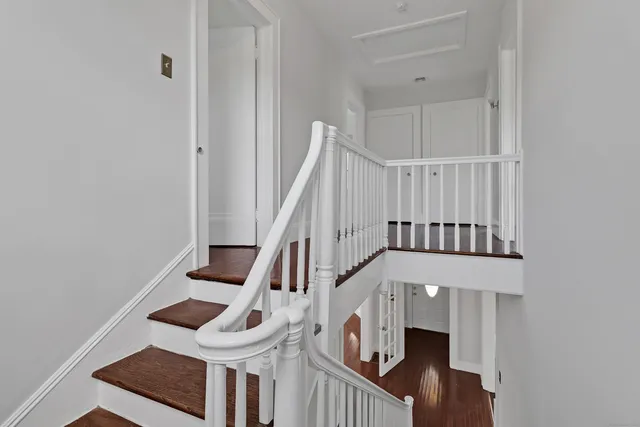a view of an entryway with wooden floor