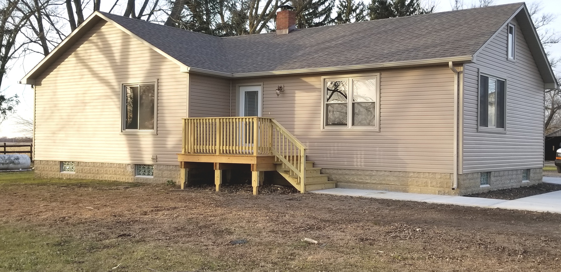 3750 West Dupont Road Morris, IL 60450 - Photo 1 of 26 a view of house with wooden deck and a yard