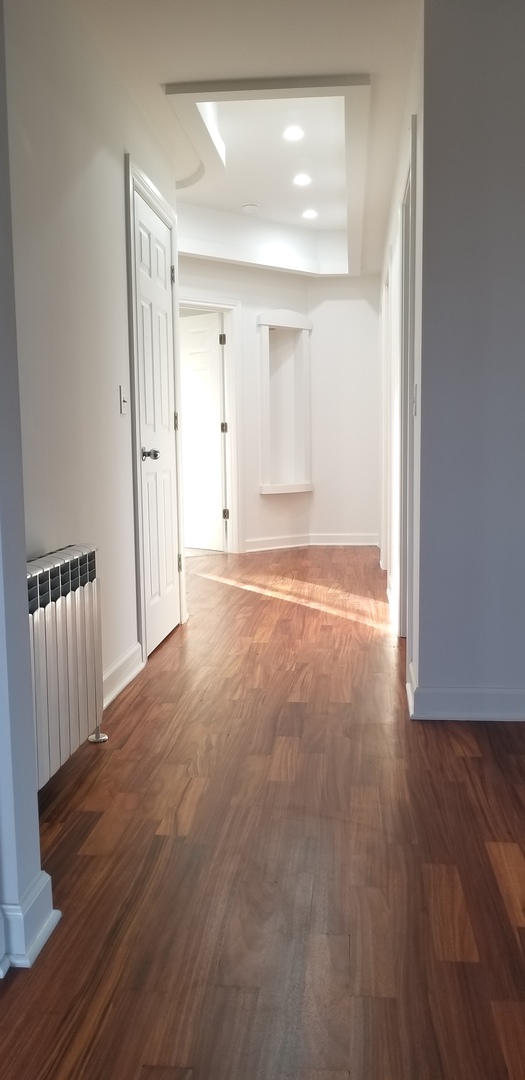 3750 West Dupont Road Morris, IL 60450 - Photo 12 of 26 a view of an empty room with wooden floor and a window