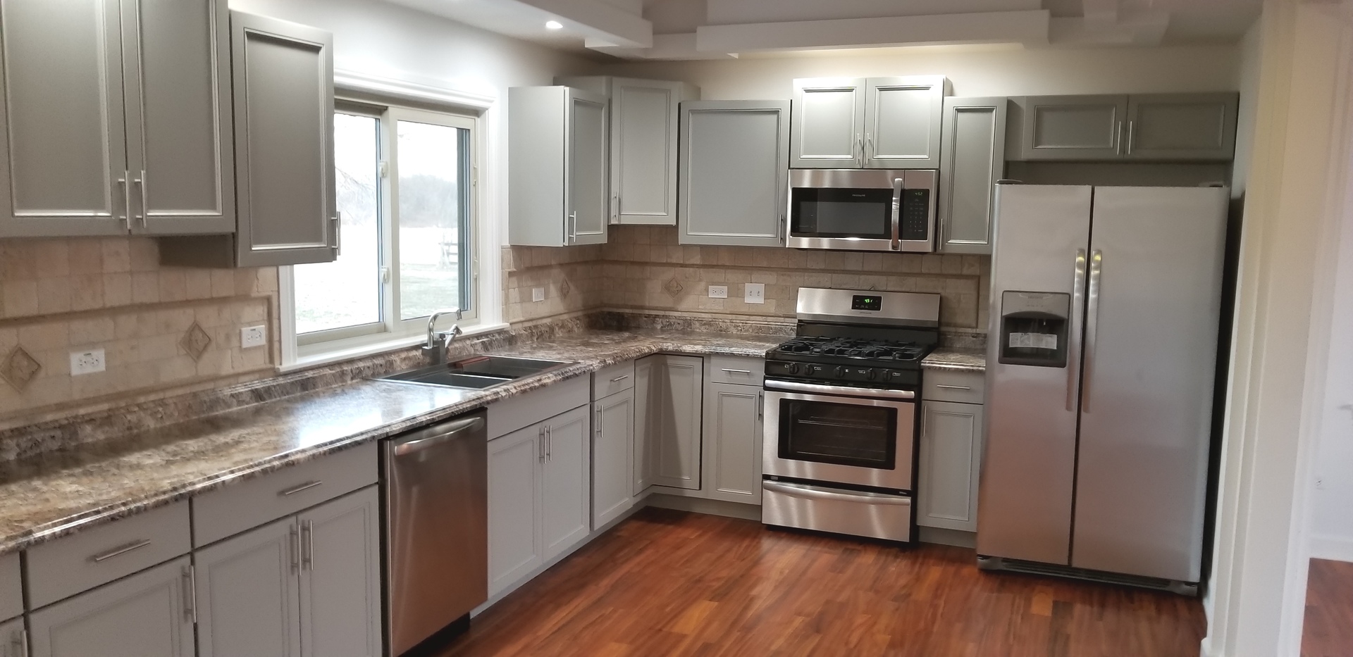 3750 West Dupont Road Morris, IL 60450 - Photo 4 of 26 a kitchen with stainless steel appliances a stove a sink and a microwave