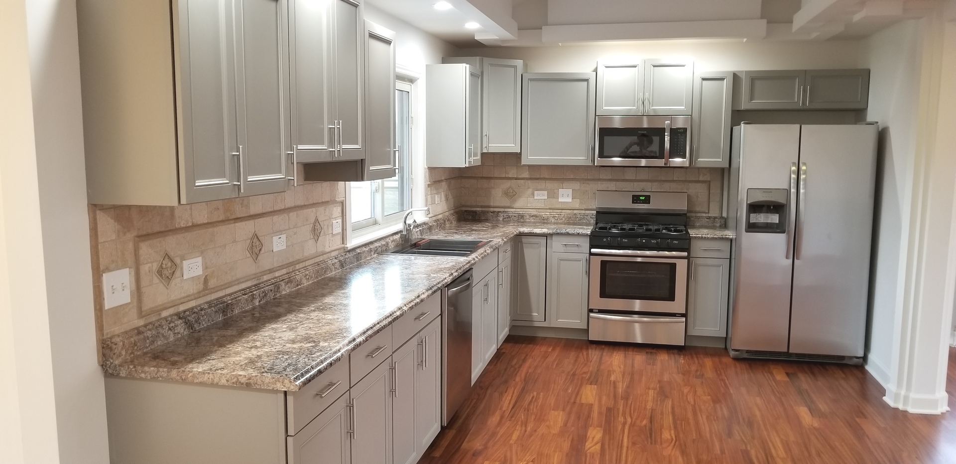 3750 West Dupont Road Morris, IL 60450 - Photo 5 of 26 a kitchen with stainless steel appliances granite countertop a stove a sink and a refrigerator