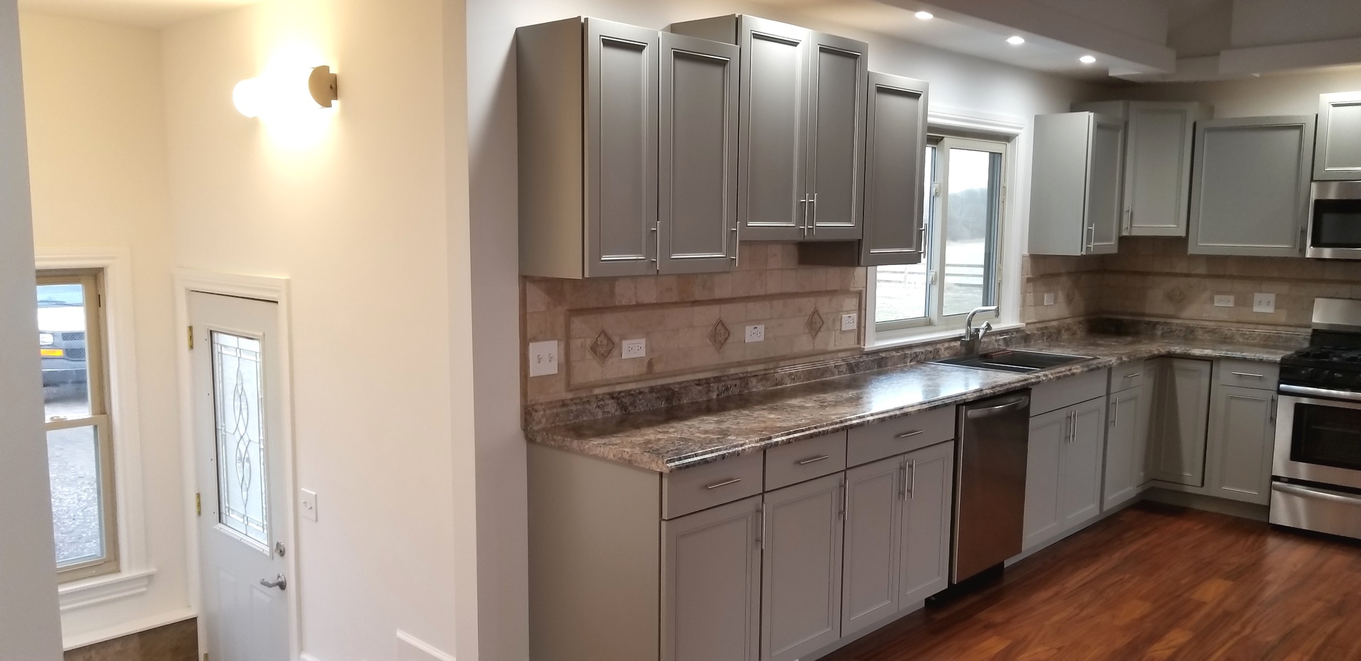 3750 West Dupont Road Morris, IL 60450 - Photo 6 of 26 a kitchen with stainless steel appliances granite countertop a sink stove and cabinets