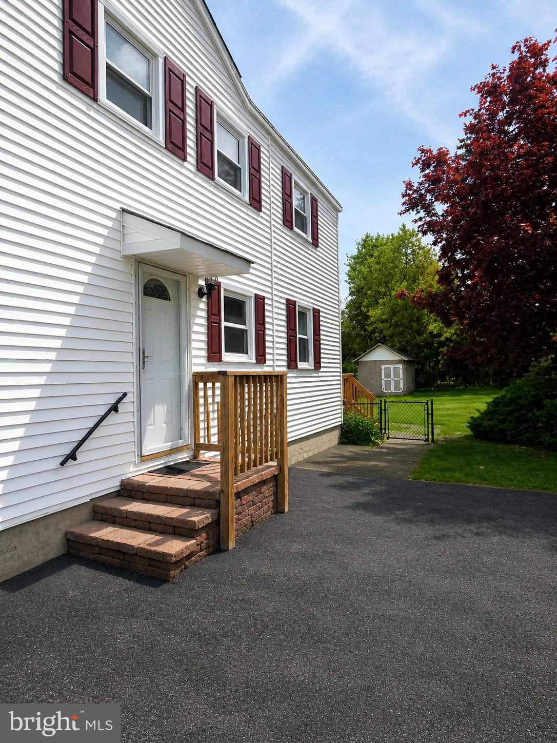 216 Georgetown Road Glassboro, NJ 08028 - Photo 14 of 17 a view of a house with a yard and deck