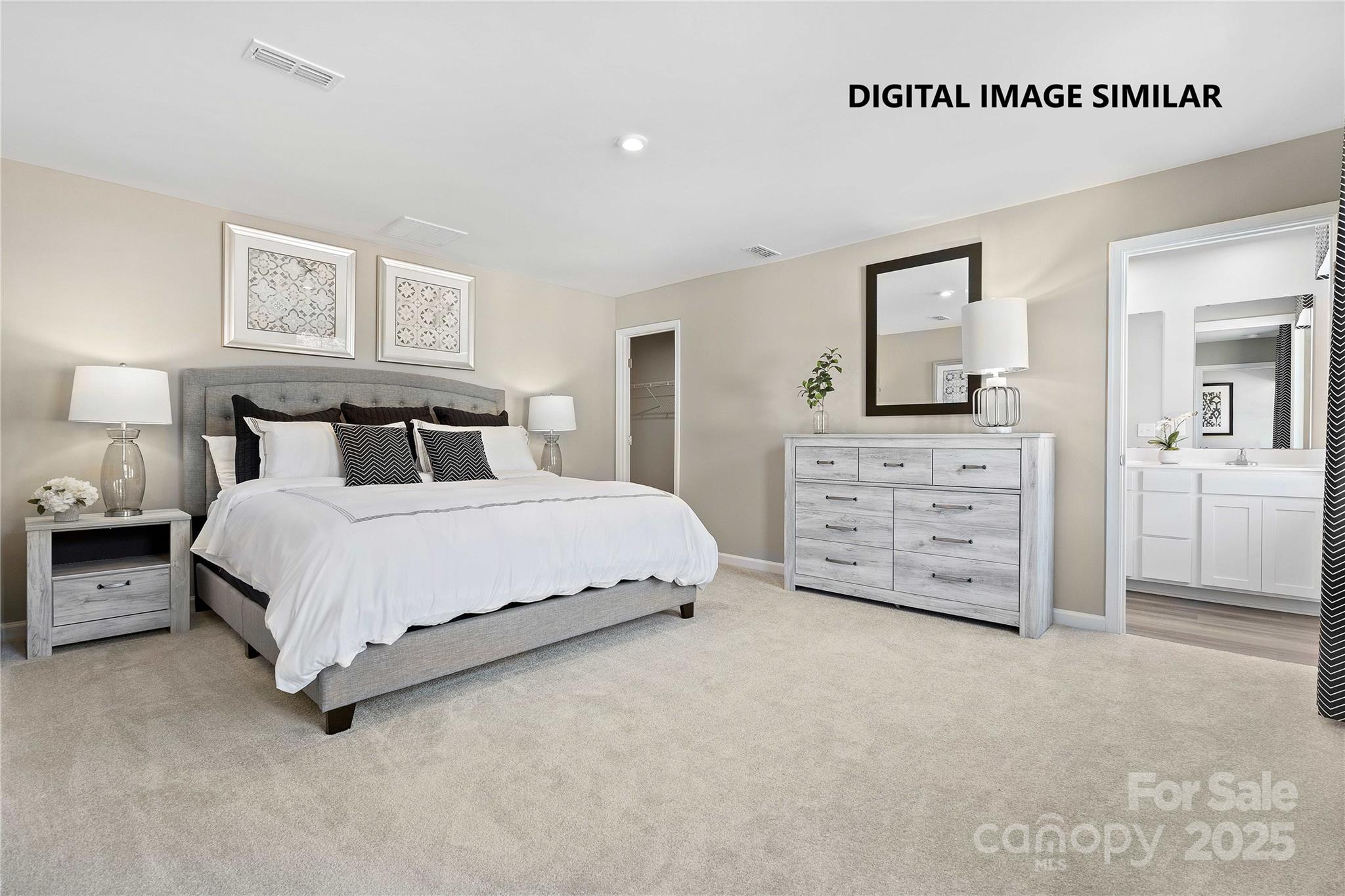 367 Maplestead Street Lancaster, SC 29720 - Photo 5 of 10 a spacious bedroom with a bed a lamp and wall painting