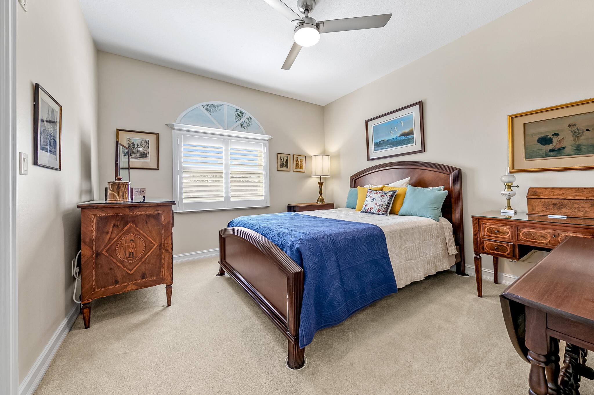 29 Riverside Drive, Unit 401 Cocoa, FL 32922 - Photo 11 of 41 a spacious bedroom with a bed and a chandelier