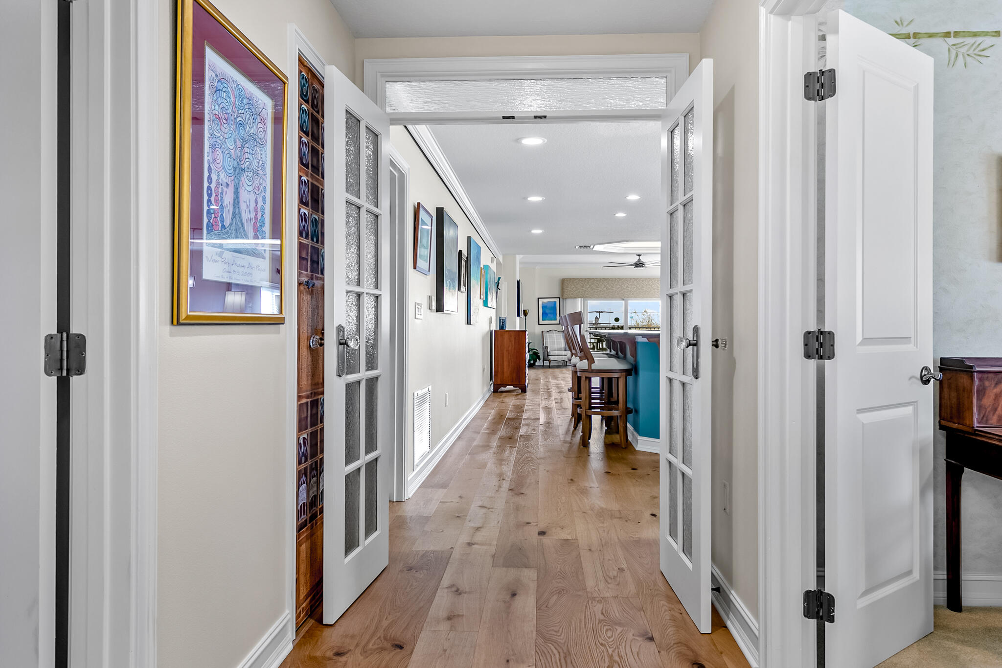 29 Riverside Drive, Unit 401 Cocoa, FL 32922 - Photo 16 of 41 a view of a hallway with wooden floor and furniture