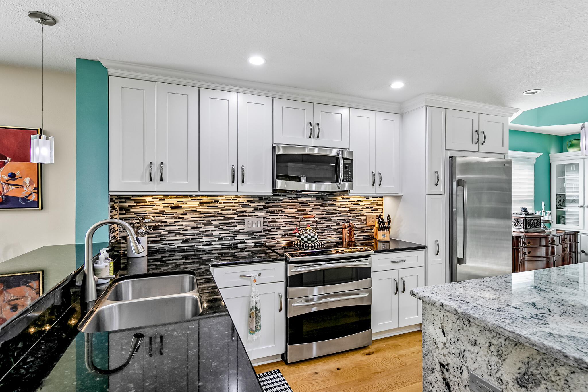 29 Riverside Drive, Unit 401 Cocoa, FL 32922 - Photo 23 of 41 a kitchen with granite countertop a refrigerator stove and oven